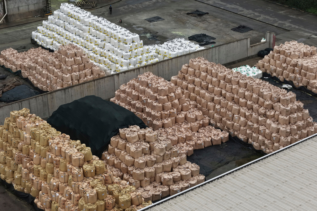 Bags of imported solid sulfur are seen at a port in Nanjing in eastern China's Jiangsu province, Tuesday, April 14, 2026. (Chinatopix Via AP) CHINA OUT