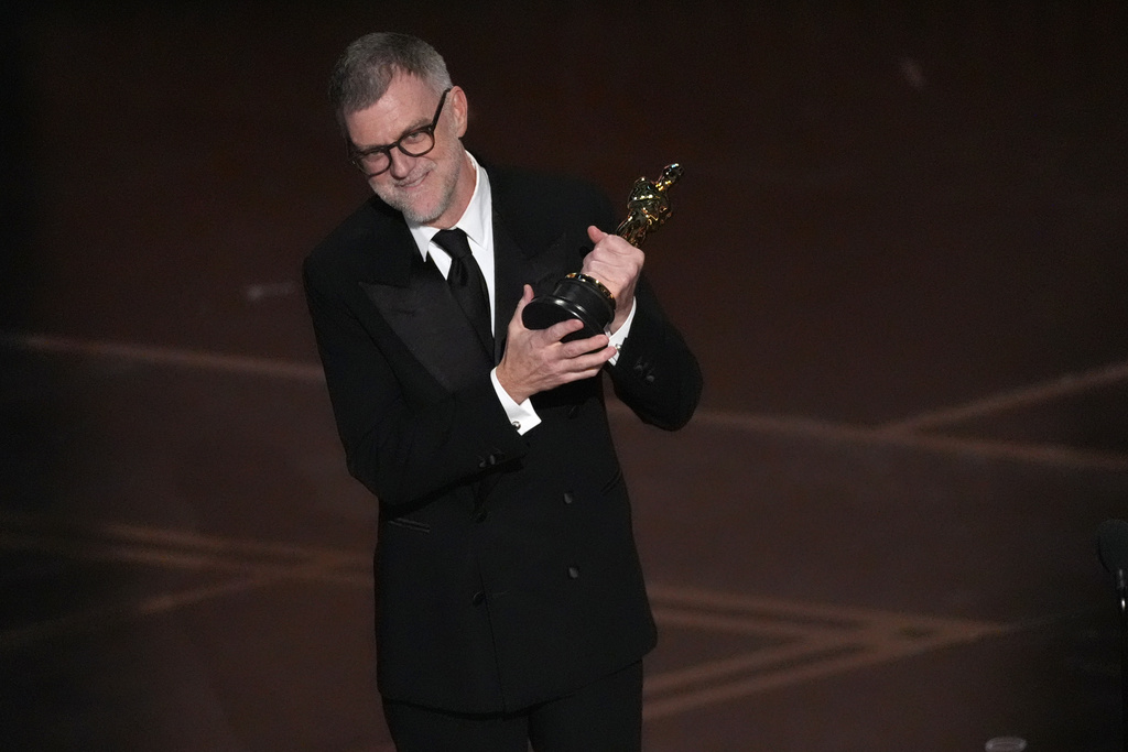 Paul Thomas Anderson accepts the award for directing for "One Battle After Another" during the Oscars on Sunday, March 15, 2026, at the Dolby Theatre in Los Angeles. (AP Photo/Chris Pizzello)