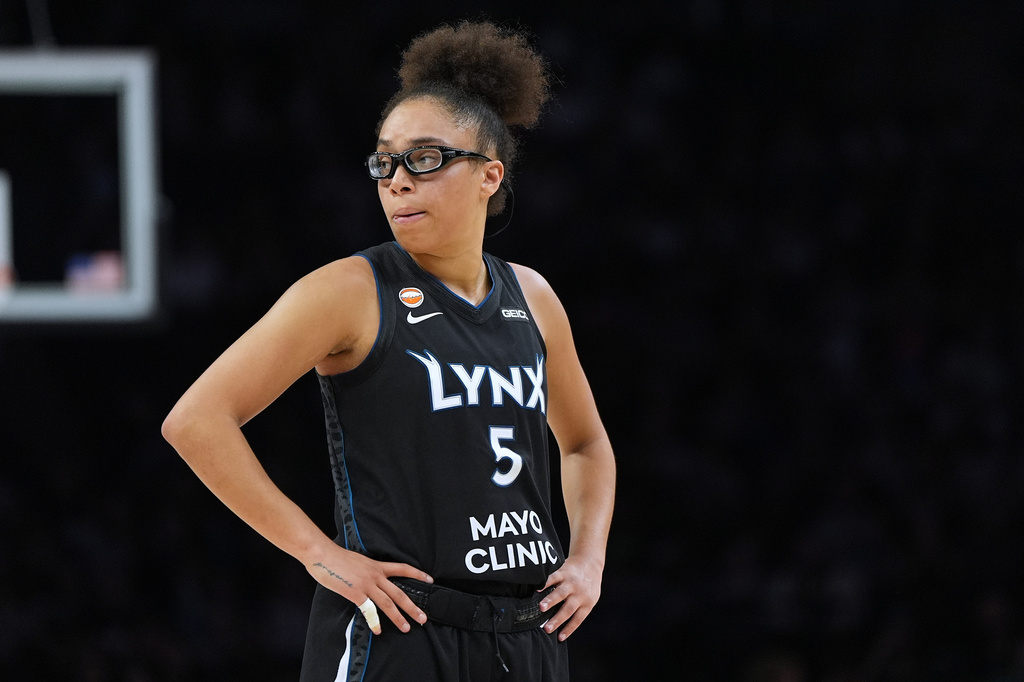 Minnesota Lynx guard Olivia Miles stands on the court during the second half of a WNBA basketball game against the New York Liberty, Friday, Sept. 18, 2026, in Minneapolis. (AP Photo/Abbie Parr)