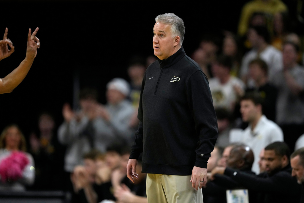 Purdue head coach Matt Painter reacts to a call during the first half of an NCAA college basketball game against Iowa, Saturday, Feb. 14, 2026, in Iowa City, Iowa. (AP Photo/Charlie Neibergall)