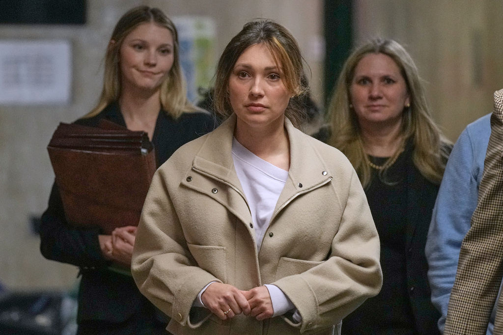 Jessica Mann, center, arrives for Harvey Weinstein's trial in criminal court, followed by Manhattan Assistant District Attorneys Candace White, left, and Nicole Blumberg, in New York, Monday, April 27, 2026. (AP Photo/Richard Drew)