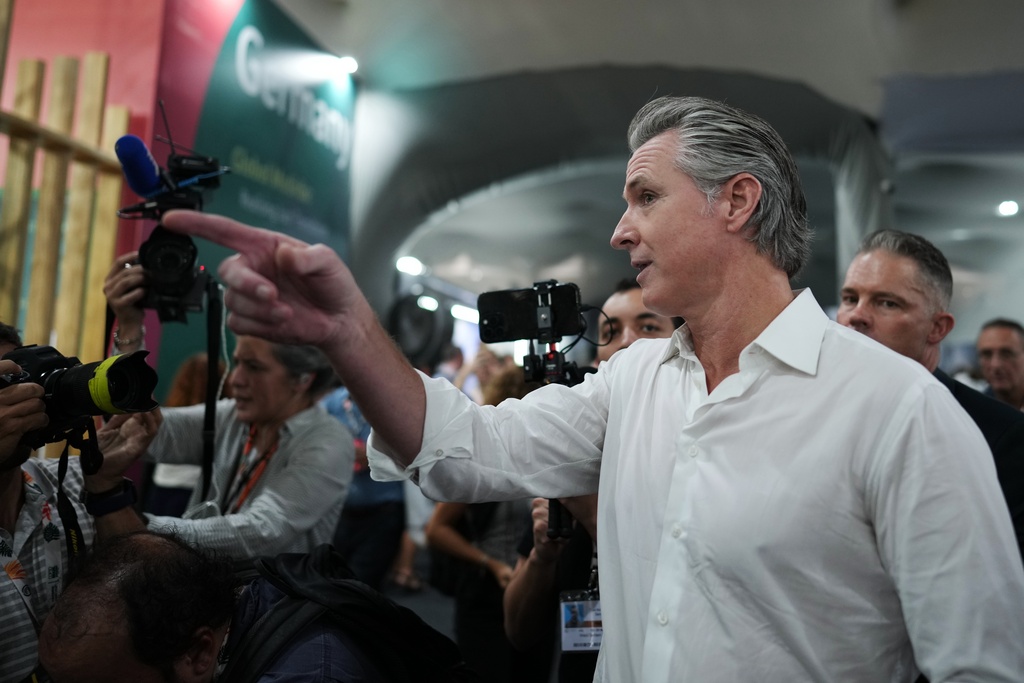 California Gov. Gavin Newsom arrives for an event at the German Pavilion at the COP30 U.N. Climate Summit, Tuesday, Nov. 11, 2025, in Belem, Brazil. (AP Photo/Andre Penner)