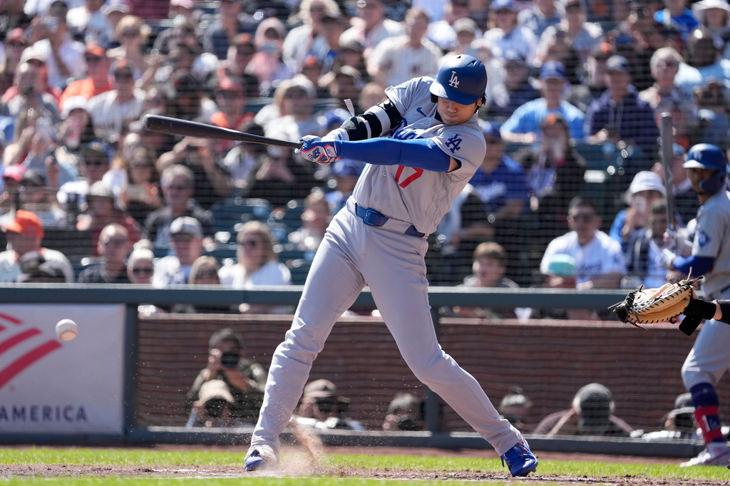 Los Angeles Dodgers' Shohei Ohtani hits a single against the San Francisco Giants during the third inning of a baseball game Sunday, Sept. 27, 2026, in San Francisco. (AP Photo/Tony Avelar)