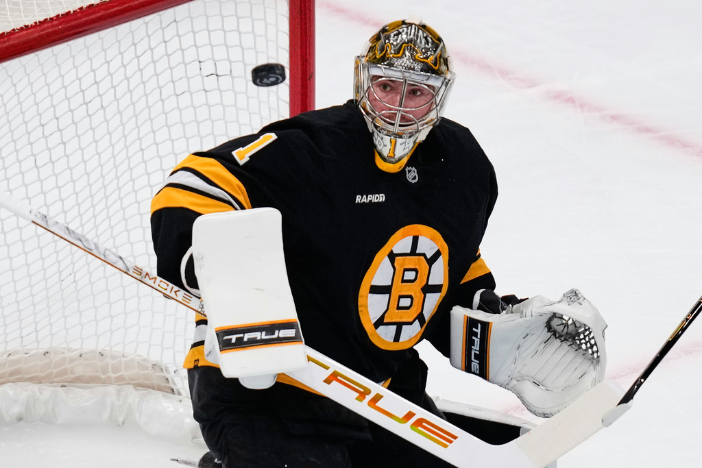 Boston Bruins goaltender Jeremy Swayman (1) eyes the puck after a save against the Los Angeles Kings during the first period of an NHL hockey game, Tuesday, March 10, 2026, in Boston. (AP Photo/Charles Krupa)