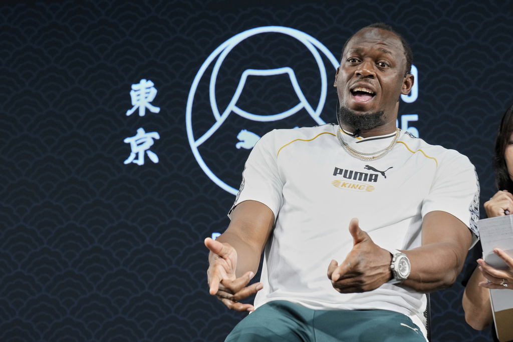 Former sprinter, Jamaica's Usain Bolt gestures during a press conference ahead of the World Athletics Championships in Tokyo, Japan, Thursday, Sept. 11, 2025. (AP Photo/Eugene Hoshiko)