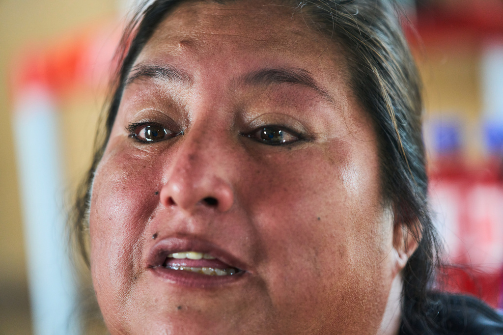 Gladys Saavedra, who works at an open-air market in Alto Trujillo and says she has been the target of gang extortion since 2018, speaks during an interview in Trujillo, Peru, Wednesday, May 27, 2026. (AP Photo/Rodrigo Abd)