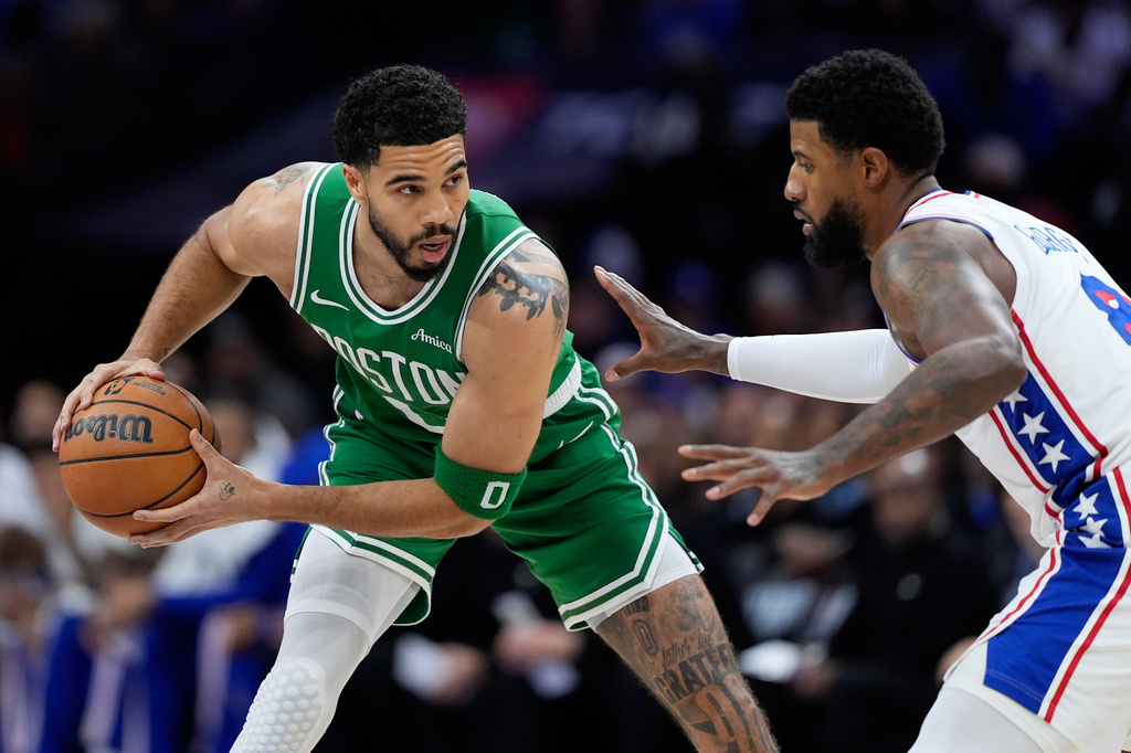 Boston Celtics' Jayson Tatum, left, tries to get past Philadelphia 76ers' Paul George during the first half of Game 6 in a first-round NBA basketball playoff series Thursday, April 30, 2026, in Philadelphia. (AP Photo/Matt Slocum)