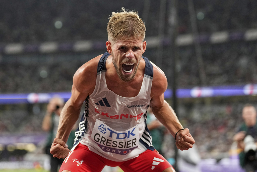 France's Jimmy Gressier celebrates as he wins the gold medal in the men's 10,000 meters final at the World Athletics Championships in Tokyo, Sunday, Sept. 14, 2025. (AP Photo/Petr David Josek)
