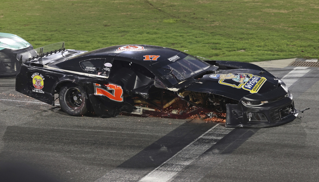 Robbie Brewer's car skids down the front stretch after a wreck on the restart on lap 16 of the first 20-lap Sportsman Series race at Bowman Gray Stadium on Saturday, Aug. 9, 2025, in Winston-Salem, N.C. (Walt Unks/The Winston-Salem Journal via AP)
