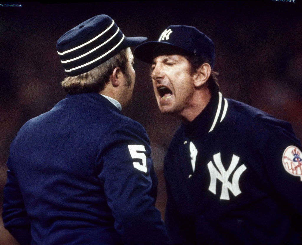 FILE - In this Oct. 21, 1976, file photo, New York Yankees manager Billy Martin argues a call with first base ump Bruce Froemming during the fourth game of baseball's World Series against the Cincinnati Reds at Yankee Stadium in New York. (AP Photo, File)