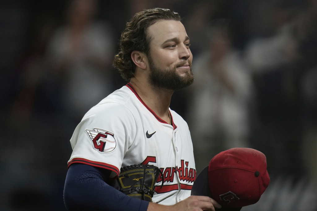 Cleveland Guardians starting pitcher Slade Cecconi walks off the mound after the eighth inning of a baseball game against the Kansas City Royals in Cleveland, Monday, Sept. 8, 2025. (AP Photo/Sue Ogrocki)