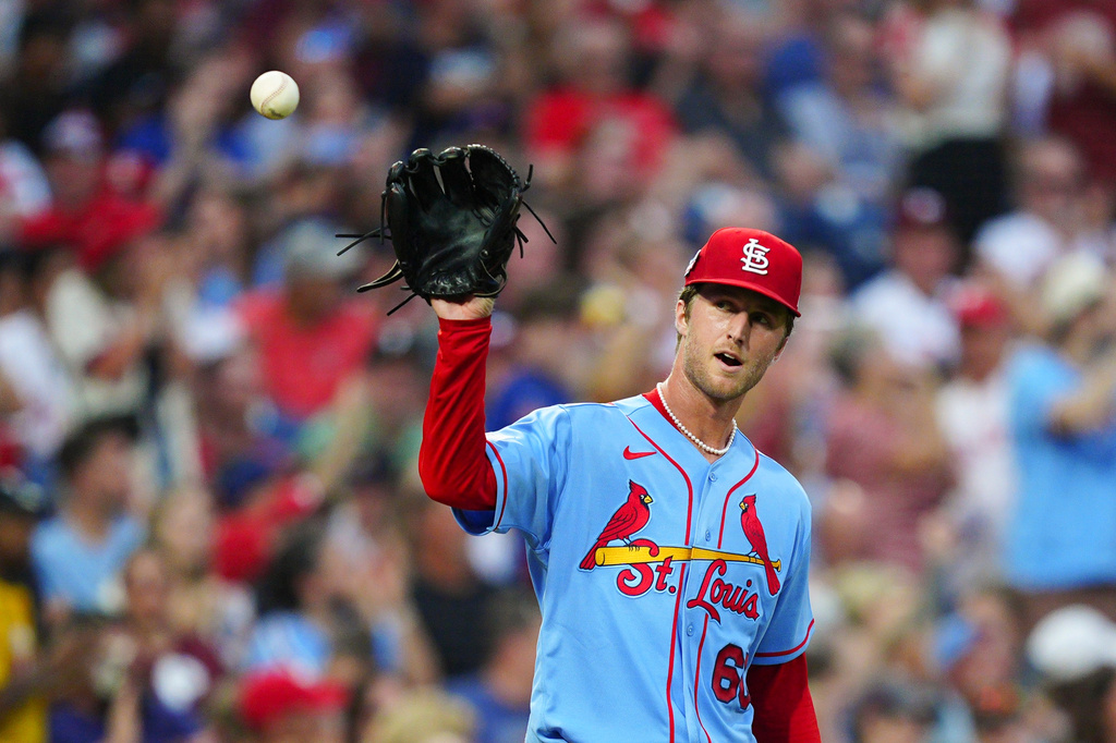 St. Louis Cardinals pitcher Quinn Mathews receives a new ball after giving up a RBI-double to Philadelphia Phillies' Derek Hill during the third inning of a baseball game, Saturday, Aug. 22, 2026, in Philadelphia. (AP Photo/Derik Hamilton)