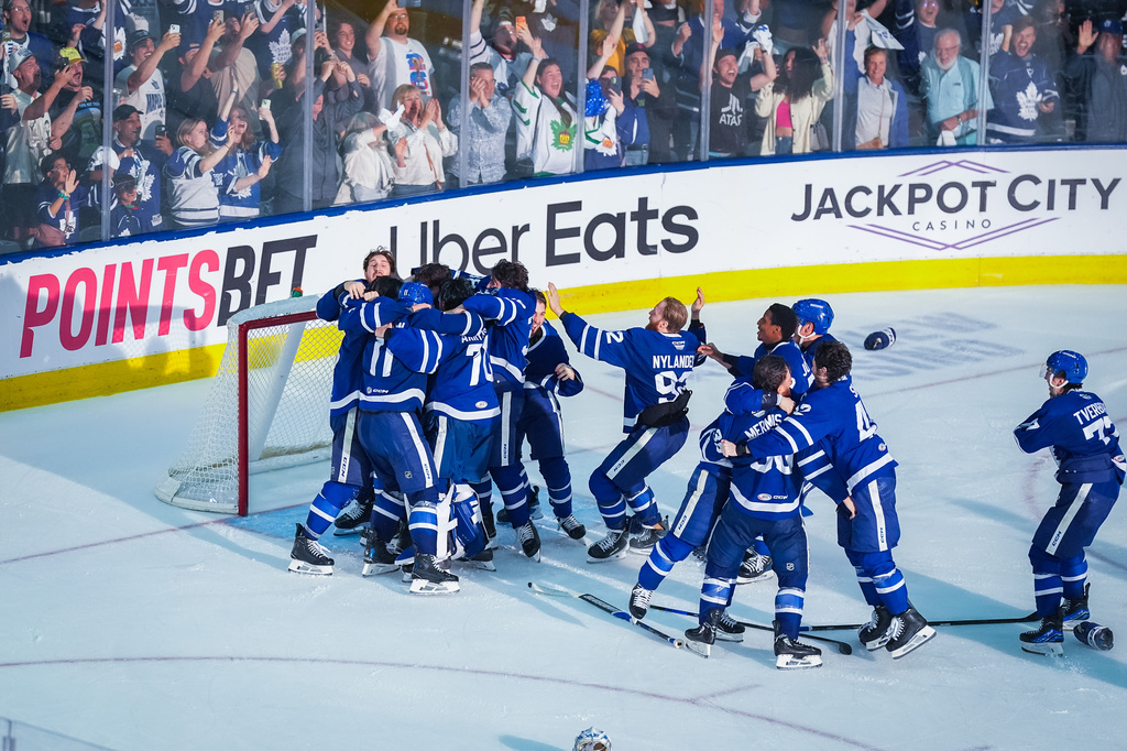 The Toronto Marlies celebrate after winning Game 5 of the AHL hockey Calder Cup final over the Chicago Wolves in Toronto, Friday, June 19, 2026. (Arlyn McAdorey/The Canadian Press via AP)