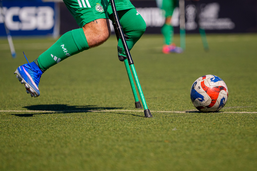 A Maccabi Haifa player follows the ball during an amputee soccer match between Maccabi Haifa and Panathinaikos in the inaugural EAFF Conference League in Bucharest, Romania, Thursday, Sept. 24, 2026. (AP Photo/Andreea Alexandru)