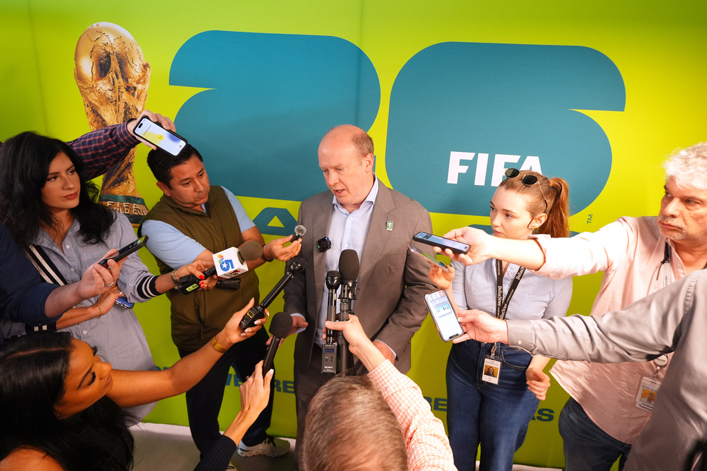 FILE - Dan Hunt, president of FC Dallas, speaks to reporter after a news conference announcing the 2026 FIFA World Cup Fan Festival soccer experience in Dallas, March 9, 2026. (AP Photo/LM Otero, File)