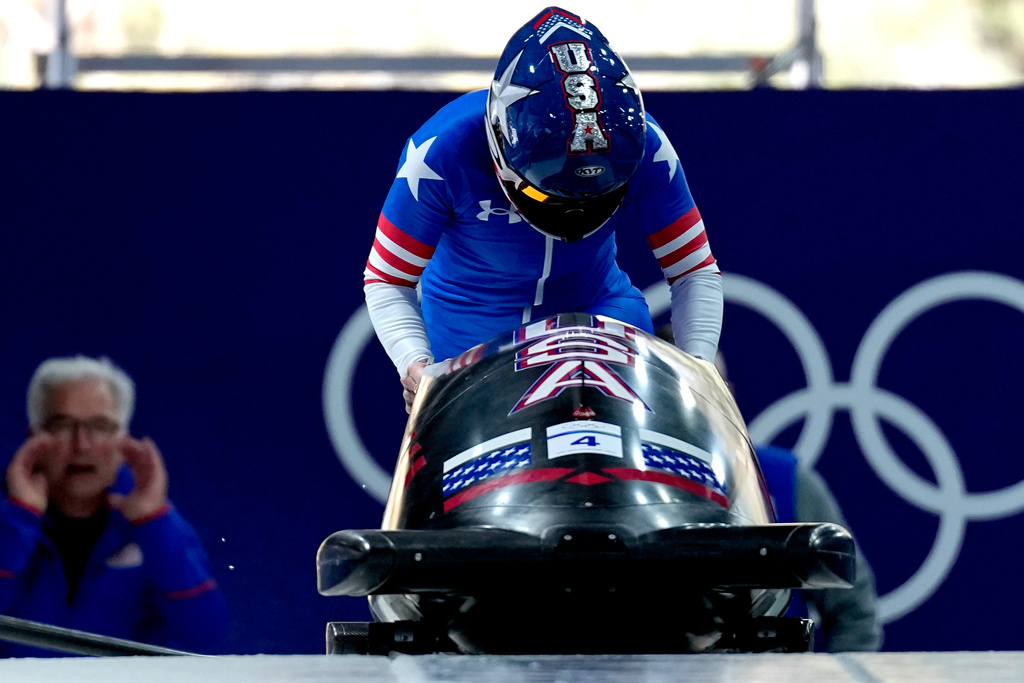 United States' Kaillie Armbruster Humphries starts for a women's monobob run at the 2026 Winter Olympics, in Cortina d'Ampezzo, Italy, Sunday, Feb. 15, 2026. (AP Photo/Aijaz Rahi)