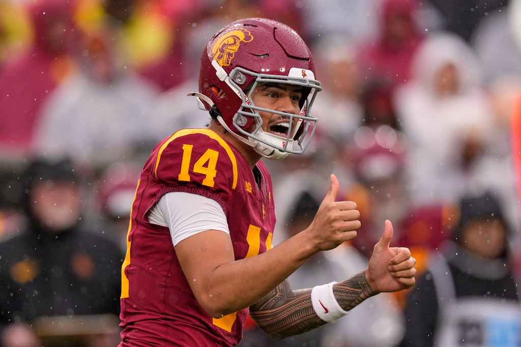 Southern California quarterback Jayden Maiava gestures to teammates during the first half of an NCAA college football game against Iowa, Saturday, Nov. 15, 2025, in Los Angeles. (AP Photo/Mark J. Terrill)