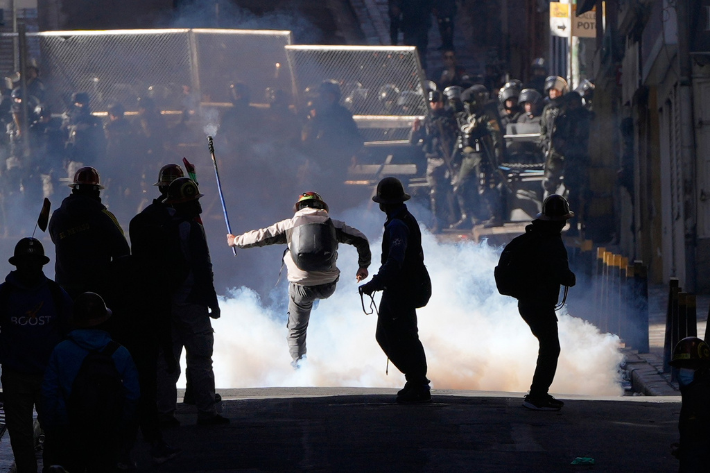 Artisanal miners clash with police demanding access to expanded mining areas in La Paz, Bolivia, Thursday, May 14, 2026. (AP Photo/Juan Karita)
