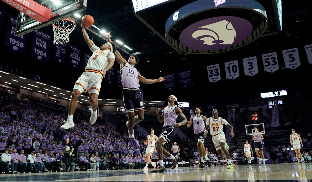 Iowa State guard Tamin Lipsey (3) gets past Kansas State forward Taj Manning (15) for a basket during the first half of an NCAA college basketball game, Sunday, Feb. 1, 2026, in Manhattan, Kan. (AP Photo/Nick Krug)