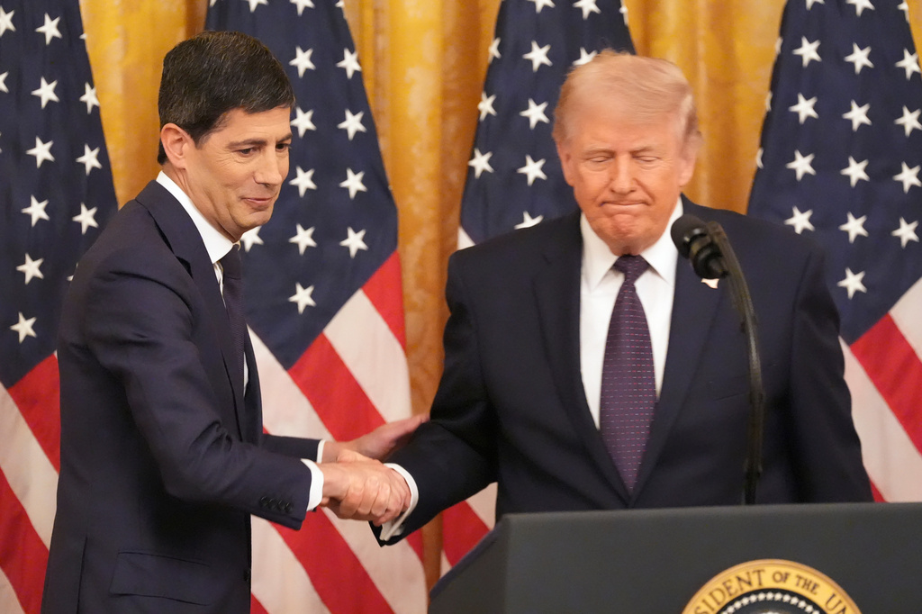 President Donald Trump, right, shakes the hand of Federal Reserve Chairman Kevin Warsh during Warsh's swearing-in in the East Room of the White House, Friday, May 22, 2026, in Washington. (AP Photo/Alex Brandon)
