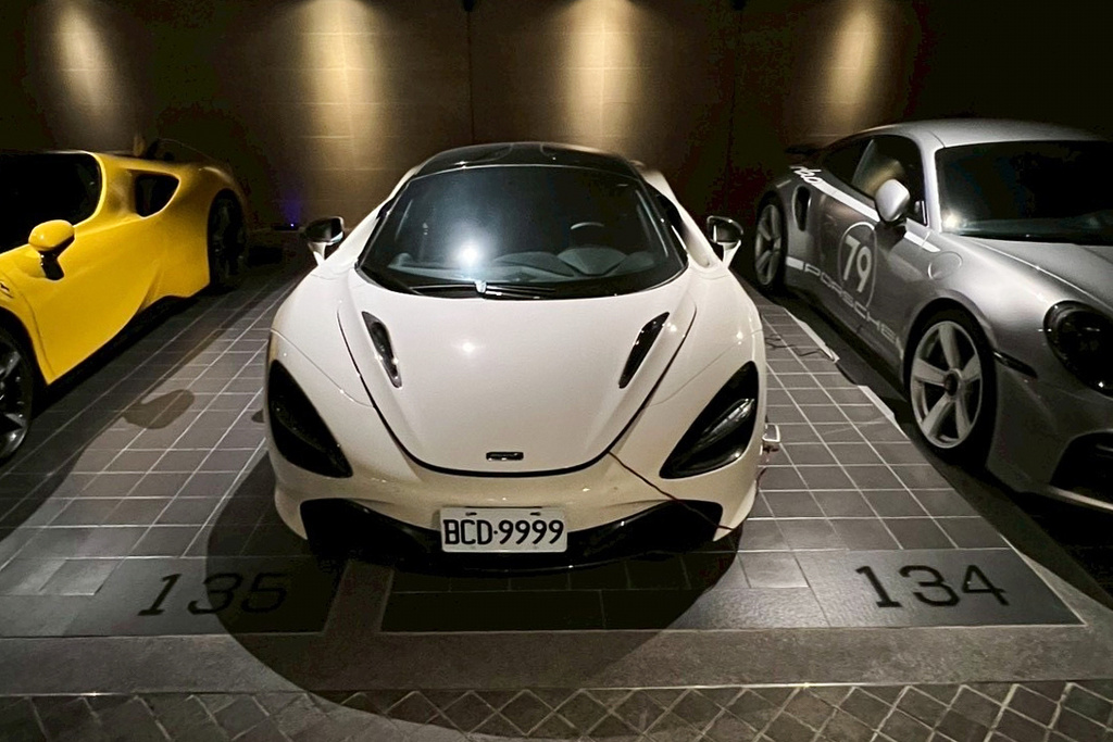 In this photo released by the Ministry of Justice Investigation Bureau, luxury sport vehicles are parked at one of the seized properties which belongs to the suspected head of a criminal scamming syndicate, in Taipei, Taiwan, Tuesday, Nov. 4, 2025. (Ministry of Justice Investigation Bureau via AP)