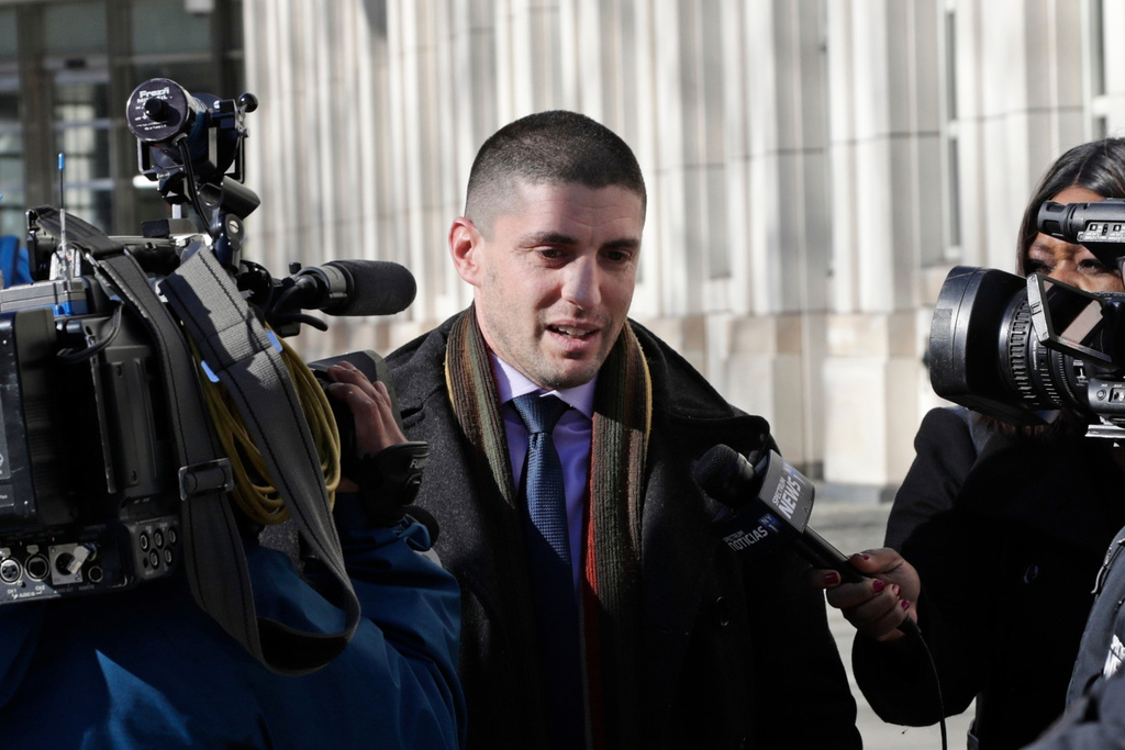 FILE - Jacob Kaplan, center, an attorney for Keith Raniere leaves Federal Court, April 20, 2018, in the Brooklyn borough of New York. (AP Photo/Frank Franklin II, File)