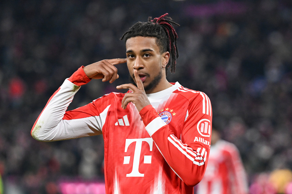 Munich's Michael Olise celebrates scoring during the Bundesliga soccer match between Bayern Munich and VfL Wolfsburg in Munich, Germany, Sunday Jan. 11, 2026. (Sven Hoppe/dpa via AP)