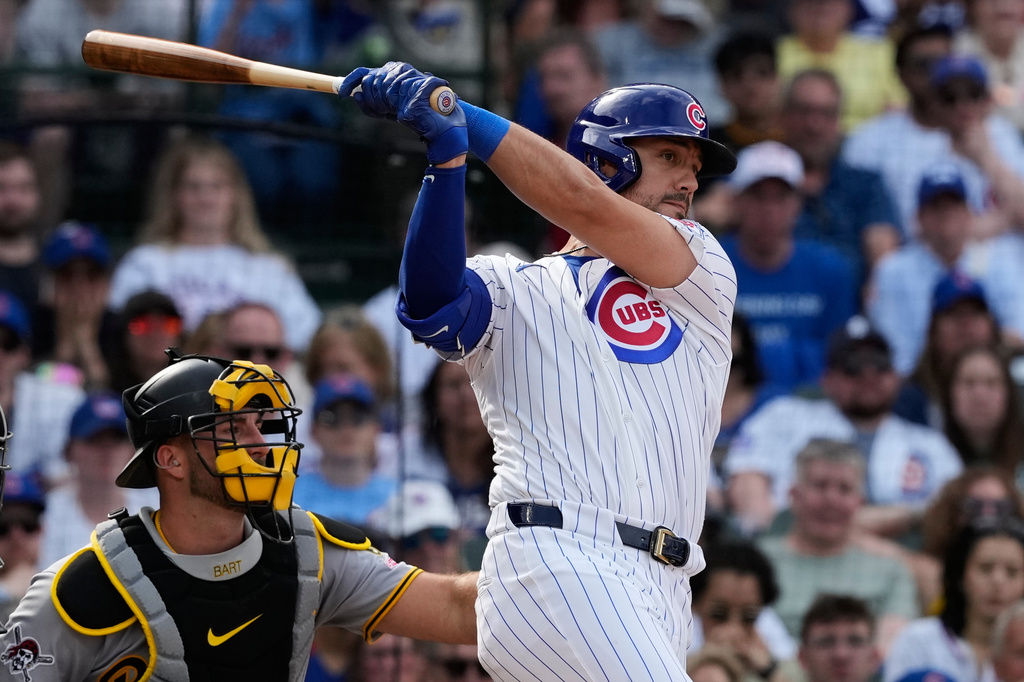 Chicago Cubs' Michael Conforto, right, hits a double during the ninth inning of a baseball game against the Pittsburgh Pirates in Chicago, Sunday, April 12, 2026. (AP Photo/Nam Y. Huh)