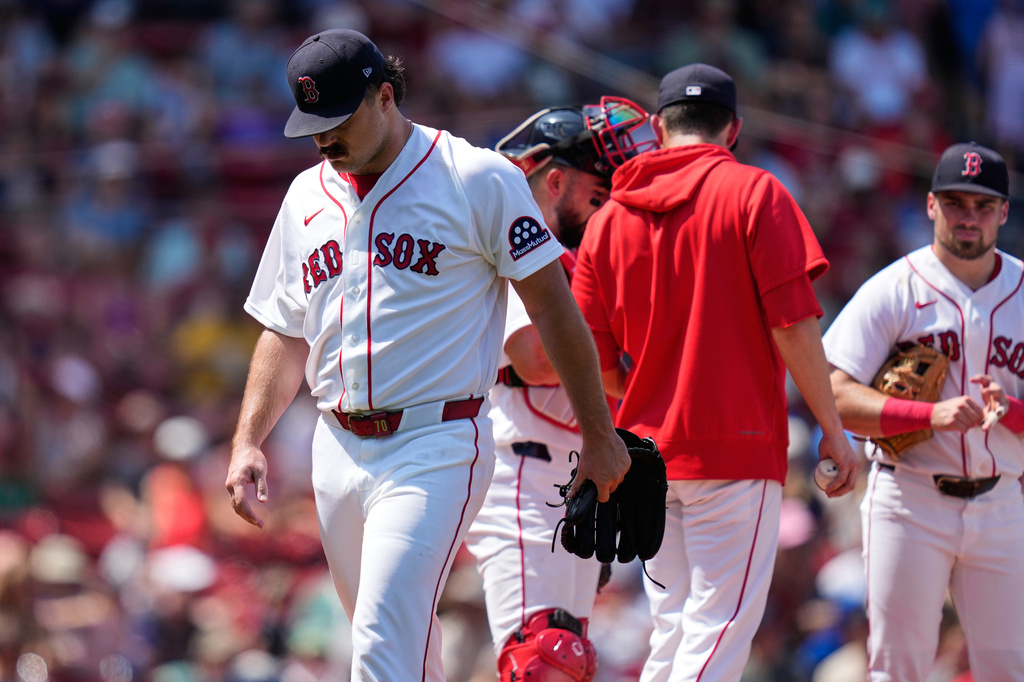 Boston Red Sox starting pitcher Payton Tolle heads to the dugout while after getting pulled in the fourth inning of a baseball game against the Washington Nationals, Wednesday, July 1, 2026, in Boston. (AP Photo/Charles Krupa)
