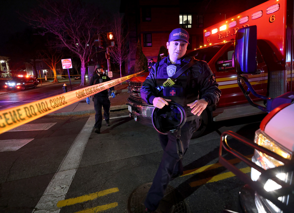 Emergency personnel gather on Waterman Street at Brown University in Providence, R.I., on Saturday, Dec. 13, 2025, during the investigation of a shooting. (AP Photo/Mark Stockwell)