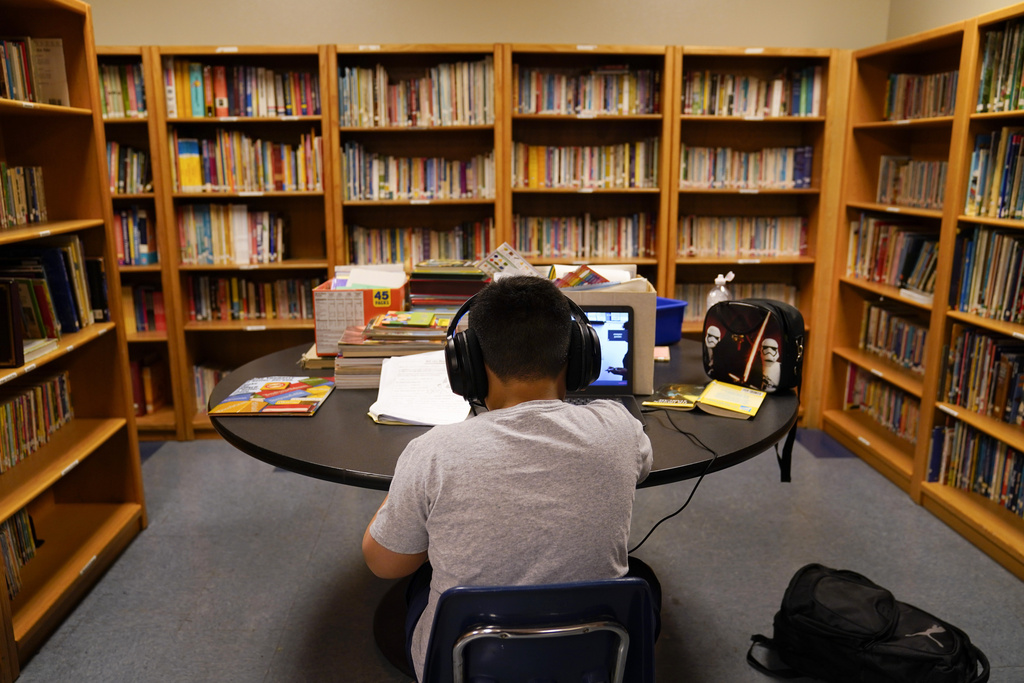 FILE - A Los Angeles Unified School District student attends an online class at the Boys & Girls Club of Hollywood in Los Angeles on Aug. 26, 2020. (AP Photo/Jae C. Hong, File)