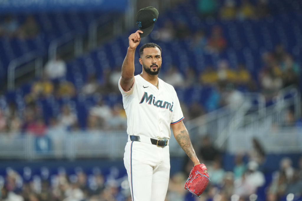 Miami Marlins pitcher Sandy Alcantara tips his cap after breaking a team record on most innings pitched during the third inning of a baseball game against the Los Angeles Angels Saturday, Aug. 8, 2026, in Miami. (AP Photo/Marta Lavandier)