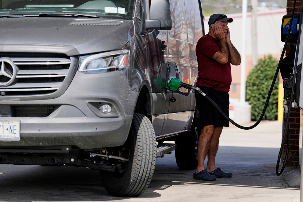 Ray Ruda fills his van with fuel at a gas station Wednesday, March 25, 2026, in Brentwood, Tenn. (AP Photo/George Walker IV)
