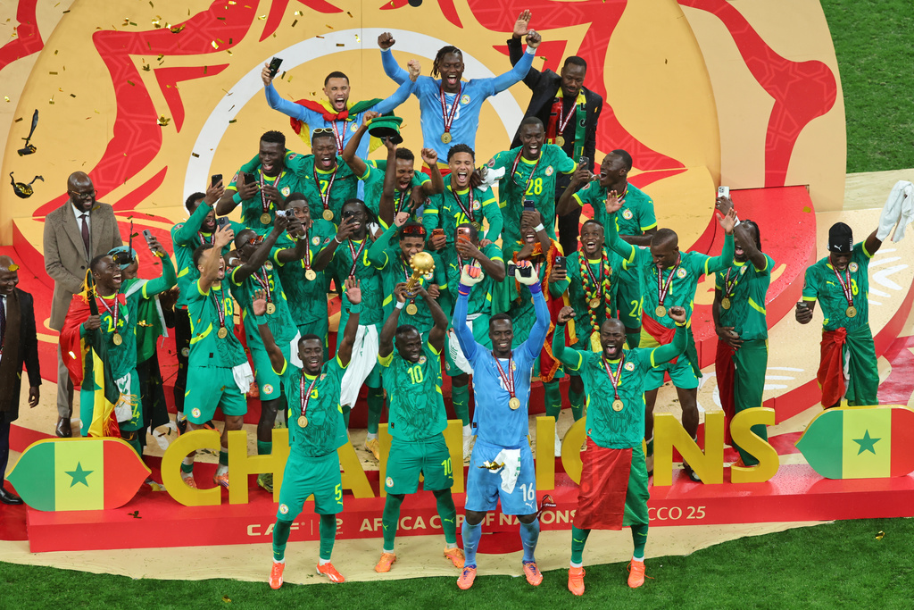 Senegal's Sadio Mane holds the trophy aloft as he celebrates with teammates after winning the Africa Cup of Nations final soccer match between Senegal and Morocco in Rabat, Morocco, Sunday, Jan. 18, 2026. (AP Photo/Youssef Loulidi)