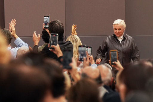The audience applauds Silvia Venturini Fendi at the end of the Fendi Spring/Summer 2026 collection presented in Milan, Italy, Wednesday, Sept. 24, 2025. (AP Photo/Antonio Calanni) The audience applauds Silvia Venturini Fendi at the end of the Fendi Spring/Summer 2026 collection presented in Milan, Italy, Wednesday, Sept. 24, 2025. (AP Photo/Antonio Calanni)