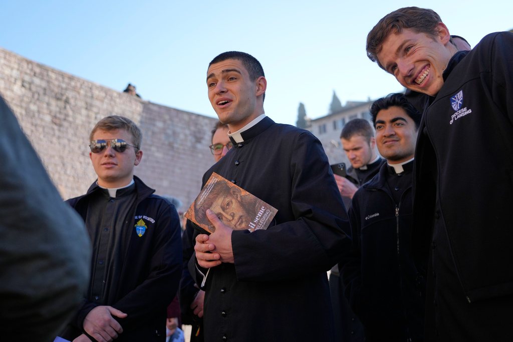 Seminarians from the Dioceses of Rockford, Illinois, and Lansing, Michigan, United States, leave after they honored the bones of St. Francis during the first public display inside the St. Francis Basilica, marking the 800th anniversary of the saint 's death, in Assisi, Italy, Sunday, Feb. 22, 2026.(AP Photo/Gregorio Borgia)
