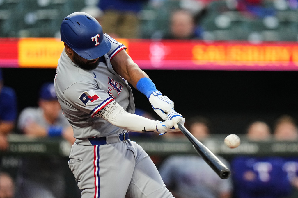 Texas Rangers' Ezequiel Duran hits a home run during the third inning of a baseball game against the Baltimore Orioles, Tuesday, March 31, 2026, in Baltimore. (AP Photo/Stephanie Scarbrough)