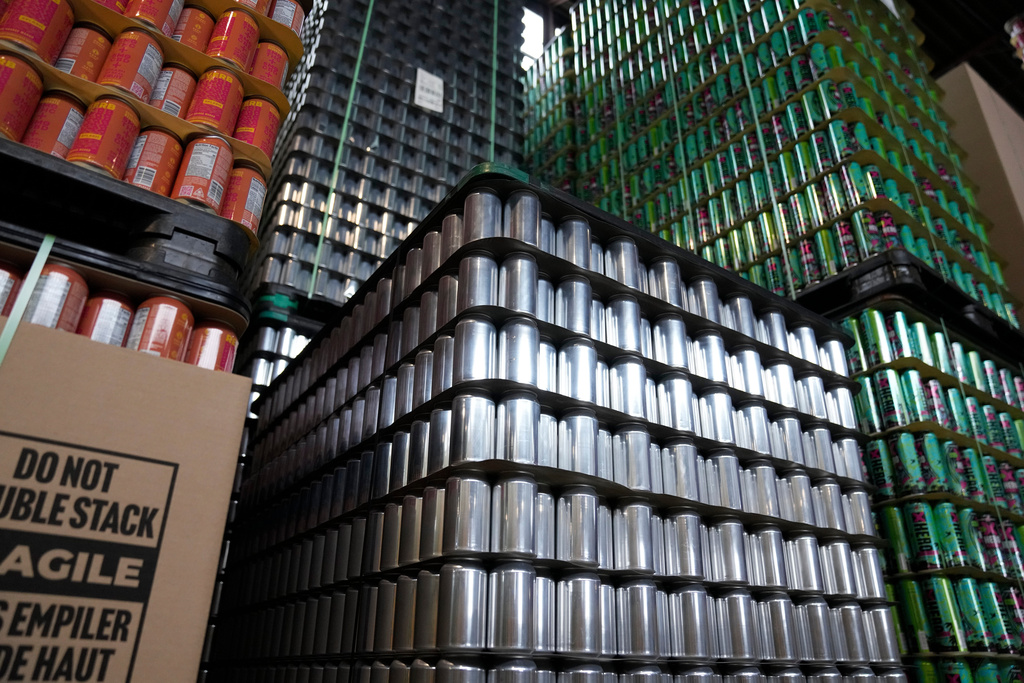 Empty aluminum cans are stacked at Revolution Brewing, Friday, Feb. 20, 2026, in Chicago. (AP Photo/Erin Hooley)
