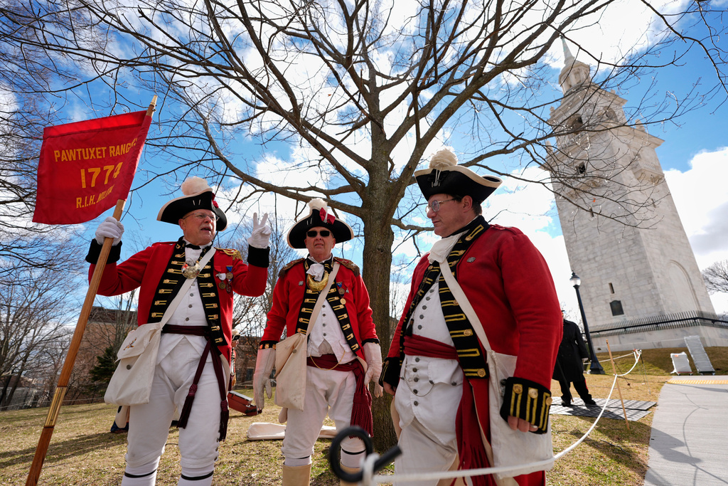 Pawtucket Rangers Militia reenactors assemble in an Evacuation Day ceremony marking the 1776 departure of British troops from the city during the American Revolutionary War, Tuesday, March 17, 2026, in Boston. (AP Photo/Robert F. Bukaty)