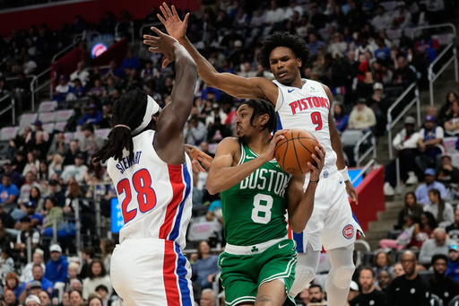 Boston Celtics forward Josh Minott, center, vies for the ball against Detroit Pistons forwards Isaiah Stewart, left, and Ausar Thompson, right, during the first half of an NBA basketball game Sunday, Oct. 26, 2025, in Detroit. (AP Photo/Ryan Sun) Boston Celtics forward Josh Minott, center, vies for the ball against Detroit Pistons forwards Isaiah Stewart, left, and Ausar Thompson, right, during the first half of an NBA basketball game Sunday, Oct. 26, 2025, in Detroit. (AP Photo/Ryan Sun)