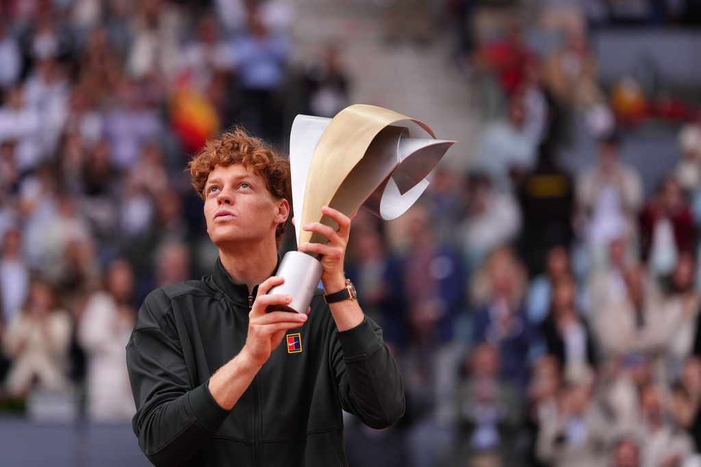 Jannik Sinner, of Italy, holds the trophy after winning the men's singles tennis final match against Alexander Zverev, of Germany, at the Madrid Open tennis tournament in Madrid, Spain, Sunday, May 3, 2026. (AP Photo/Manu Fernandez)