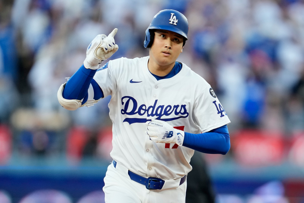 Los Angeles Dodgers' Shohei Ohtani celebrates after a home run against the Milwaukee Brewers during the first inning in Game 4 of baseball's National League Championship Series, Friday, Oct. 17, 2025, in Los Angeles. (AP Photo/Ashley Landis)
