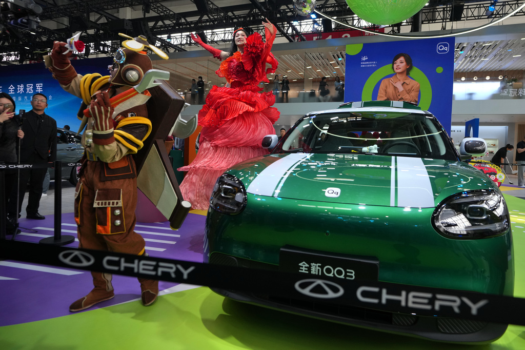 Artists perform to promote the Chinese automaker Chery new QQ3 model showcased at the Auto China 2026, in Beijing, Saturday, April 25, 2026. (AP Photo/Andy Wong)