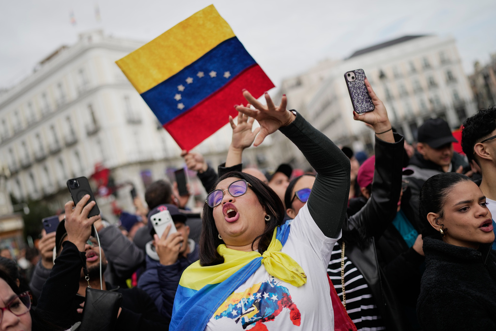 Venezuelan Wiliana Flores celebrates in Madrid after U.S. President Donald Trump announced that Venezuelan President Nicolás Maduro had been captured and flown out of the country on Saturday, Jan. 3, 2026. (AP Photo/Bernat Armangue)