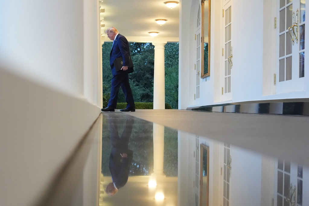 President Donald Trump walks along the colonnade to attend a dinner in the Rose Garden of the White House, Thursday, Sept. 17, 2026, in Washington. (AP Photo/Alex Brandon)