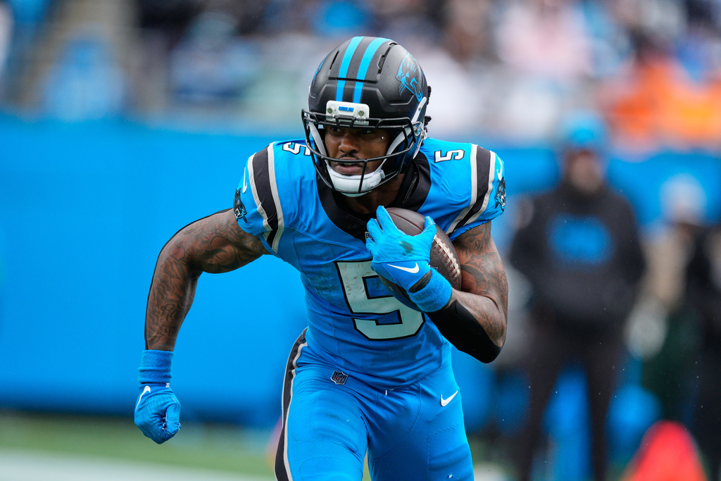 Carolina Panthers running back Rico Dowdle runs the ball against the Dallas Cowboys in the first half of an NFL football game, Sunday, Oct. 12, 2025, in Charlotte, N.C. (AP Photo/Jacob Kupferman)