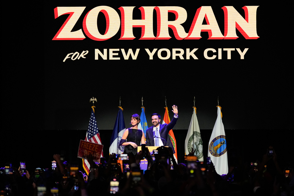 Mayor-elect Zohran Mamdani, right, and his wife Rama Duwaji react to supporters during an election night watch party, Tuesday, Nov. 4, 2025, in New York. (AP Photo/Yuki Iwamura)