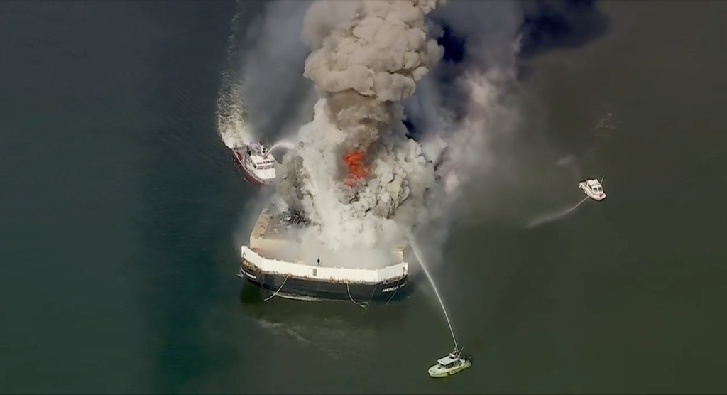 Firefighters battle a massive blaze that erupted on a barge on the Delaware River on Tuesday, March 10, 2026 in New Castle, Del. (WPVI via AP)