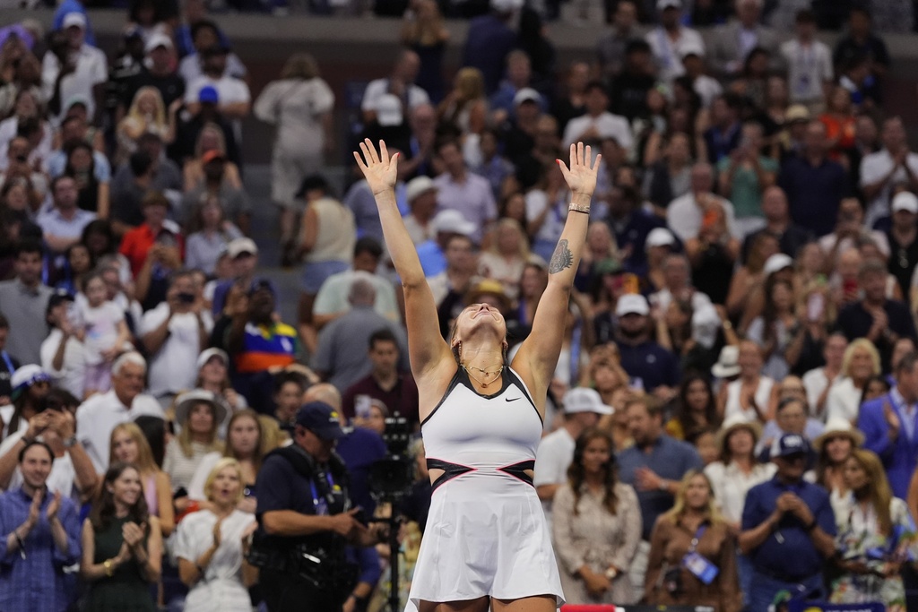 Aryna Sabalenka, of Belarus, reacts after defeating Amanda Anisimova, of the United States, during the women's finals of the U.S. Open tennis championships, Saturday, Sept. 6, 2025, in New York. (AP Photo/Yuki Iwamura)