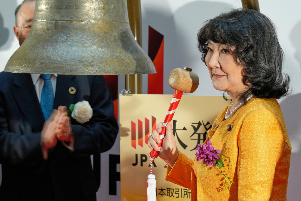 Finance Minister Satsuki Katayama rings the bell during a ceremony marking the start of trading at the Tokyo Stock Exchange, Monday, Jan. 5, 2026, in Tokyo. (AP Photo/Eugene Hoshiko)